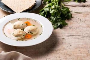 Traditional Jewish matzah ball soup photo