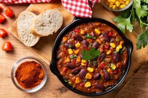 Traditional mexican tex mex chili con carne in iron pan photo