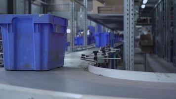 close up parcels in blue box on conveyor video