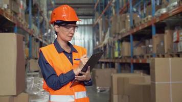 female at work in warehouse. video