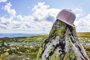 Cap capy on big rock amazing norwegian mountain landscape Norway photo