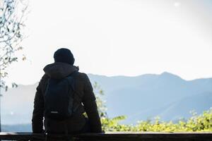 Men traveller going alone in the wild photo