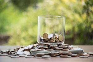 save money for investment concept coin baht thai in the glass jar photo