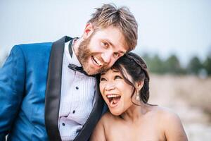 Asian bride and Caucasian groom have romance time and happy together photo