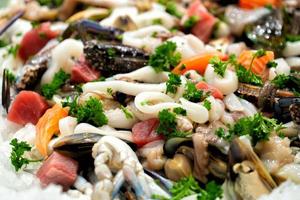 fresh mixed seafood on ice photo