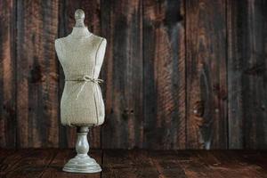 Antique Mannequin Busts on Wood Grunge Background photo