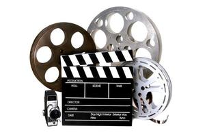 Film Reels and Directors Clapper With Vintage Camera photo