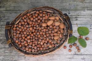 basket with hazelnuts and almonds photo