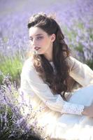 Pretty Young Girl Outdoors in a Lavender Flower Field photo