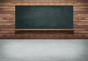 Table with wooden wall and blackboard background photo