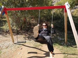 woman has fun with swing photo