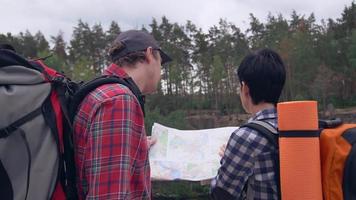 Man and woman hikers in spring season. video