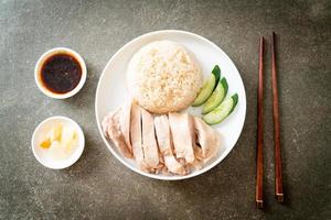 Hainanese chicken rice or rice steamed with chicken soup photo