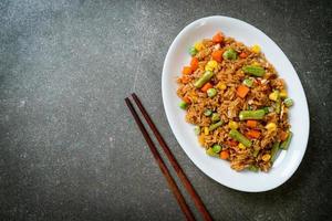 fried rice with green peas, carrot and corn photo