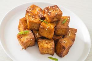 fried tofu with white sesame and teriyaki sauce photo