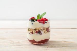 homemade raspberry and blueberry with yogurt and granola photo