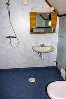 Cottage vacation interior decoration. Blue shower and toilet in Norway photo