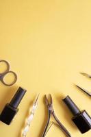 Flat lay manicure tools on a colored background with copy space photo