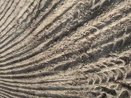 Textured background of plowed field photo