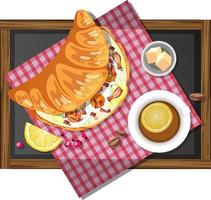 Sándwich de croissant de desayuno con una taza de té de limón en una placa de madera aislada vector