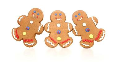 Happy Smiling Gingerbread Figures on White photo