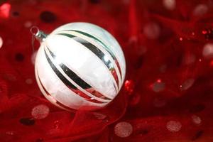 Holiday Ornament on Festive Fabric photo