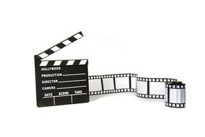 Clapboard and film strip on white background photo