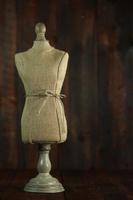 Antique Mannequin Busts on Wood Grunge Background photo