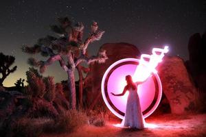 Person Light Painted in the Desert Under the Night Sky photo