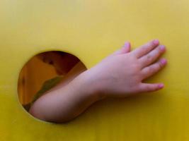 Asian little girl enjoys playing at playground photo