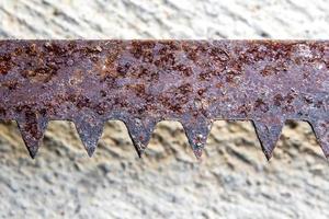 The sharpness of saw blade is old and rusty photo