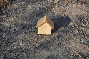 Model of a wooden house as a family property photo