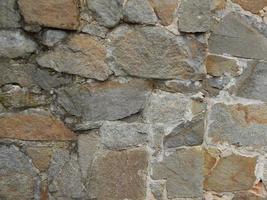 The texture of stone and brick paving and walls photo