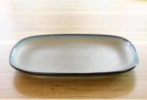 modern plate on wood table background photo