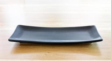 modern plate on wood table background photo