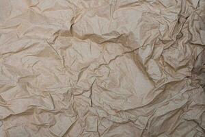 Close up crumpled creased paper old texture background photo