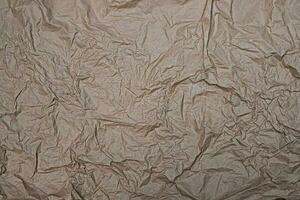 Close up crumpled creased paper old texture background photo