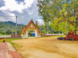 Colorful architecture of entrance gate Wat Ratchathammaram temple Thailand photo