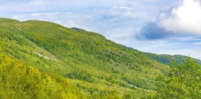 Incredible norwegian landscape with mountains clouds forests Jotunheimen Norway photo