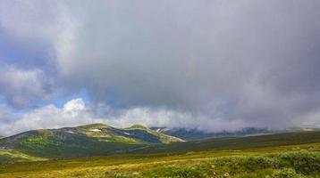 Incredible norwegian landscape colorful mountains clouds forests Jotunheimen Norway photo