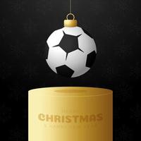 football Sport Christmas bauble pedestal. Merry Christmas sport greeting card. Hang on a thread soccer, football ball as a xmas ball on golden podium on black background. Sport Vector illustration.