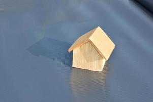 Model of a wooden house as a family property photo