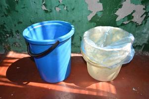There are trash cans with bags for throwing garbage into a container photo