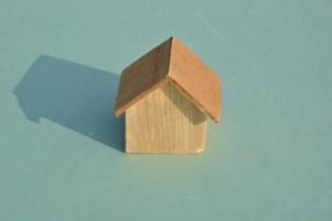 Model of a wooden house as a family property photo
