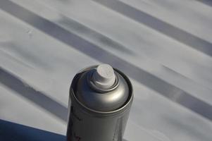 Roof painting with enamel paint from an aerosol can photo