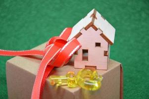 Receiving keys to his apartment building on a background of green grass photo