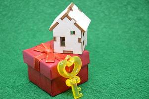 Receiving keys to his apartment building on a background of green grass photo