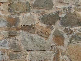 The texture of stone and brick paving and walls photo
