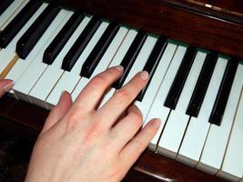 Piano keys hand photo