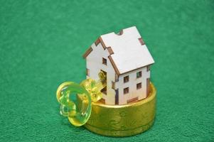 Receiving keys to his apartment building on a background of green grass photo